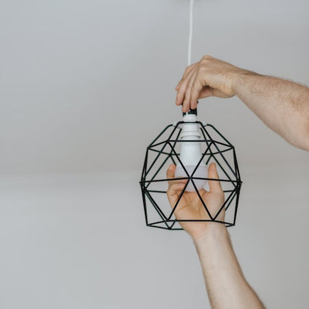 Photo by Anete Lusina: https://www.pexels.com/photo/crop-man-screwing-light-bulb-into-ornamental-lamp-4792526/